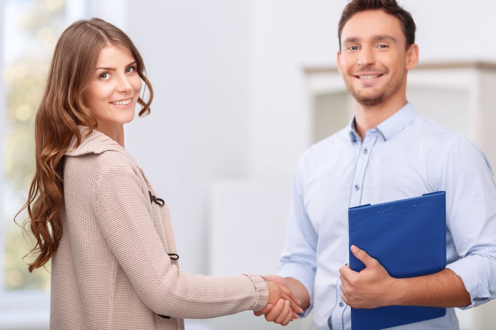 realtor shaking hands with client